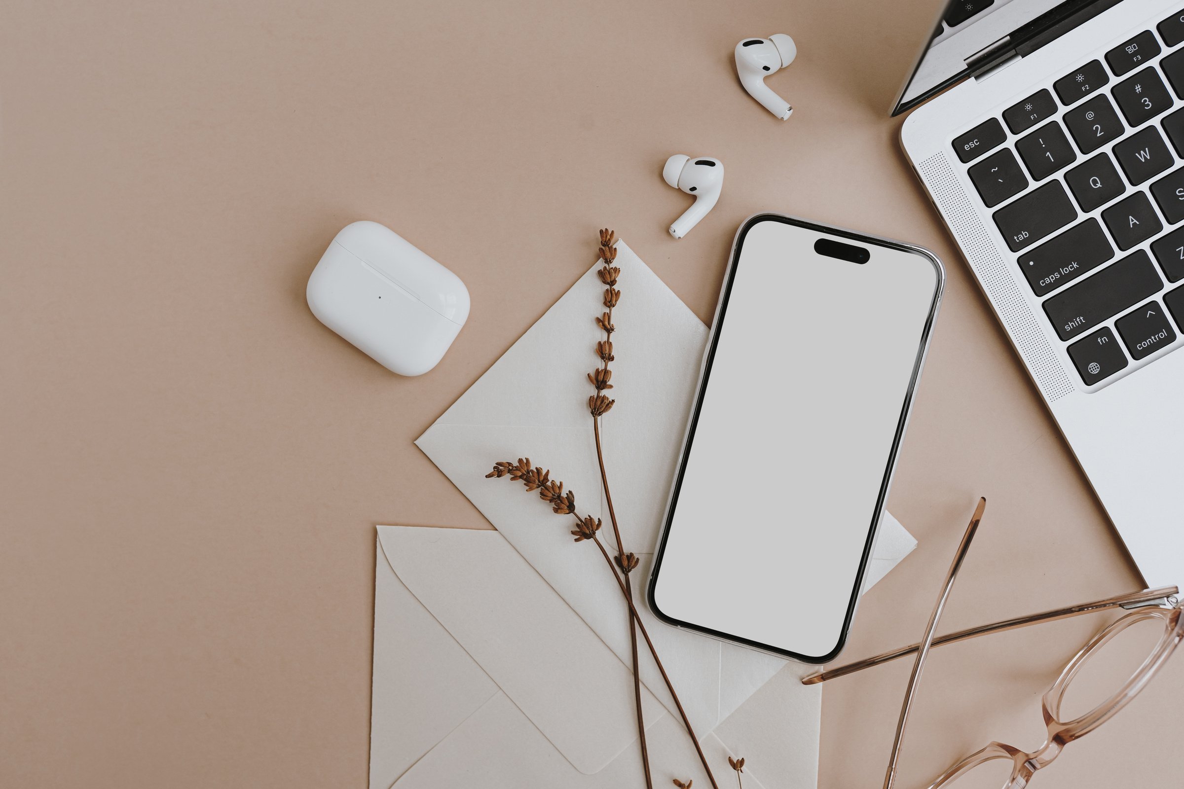 Smartphone, Laptop, Ear Pods, Eyeglasses, Flowers, and Card